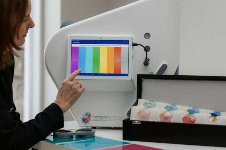 Criona Leahy Optometrist performs a coloured overlay assessment for dyslexic readers on a Cerium machine